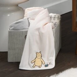 Storytime Pooh Baby Blanket -Lambs & Ivy storytime pooh blanket lifestyle