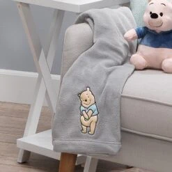 Winnie The Pooh Hugs Baby Blanket -Lambs & Ivy winnie the pooh hugs blanket lifestyle